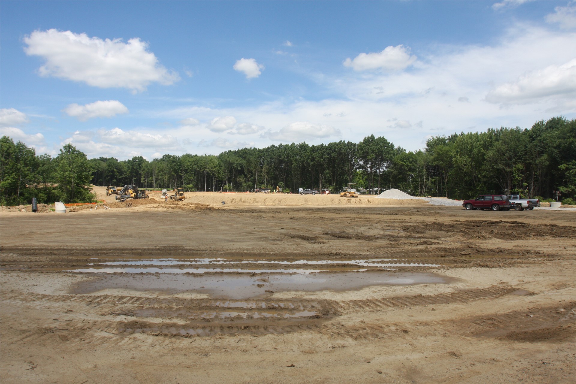 Building pad in distance, staff parking lot in foreground