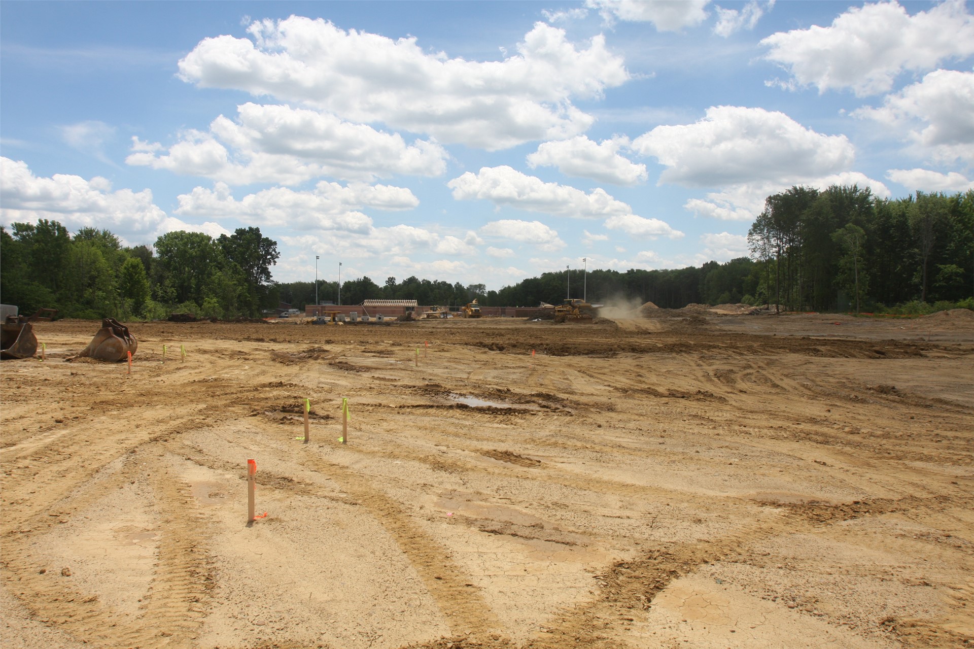 Stadium in distance, parking lot in middle, administrative/guidance offices in foreground