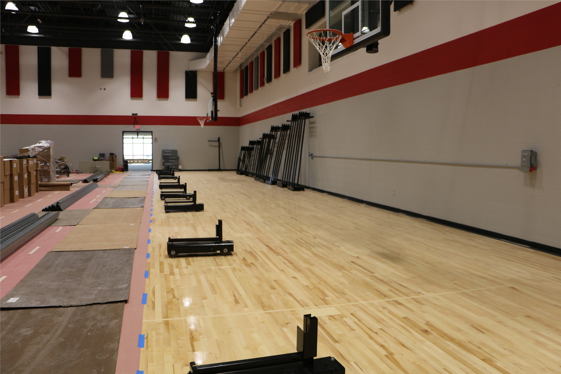 Bleachers are being installed in the gymnasium