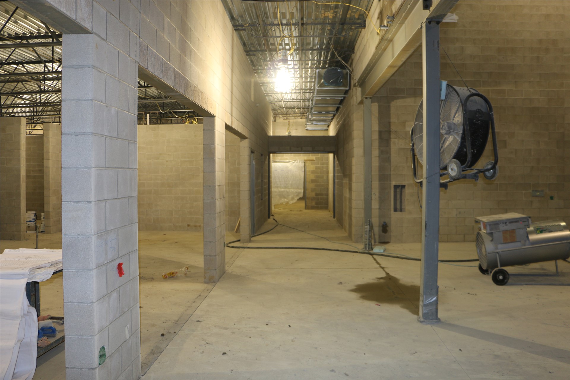 Kitchen serving area (left), hallway to custodial (middle), The Commons (right)