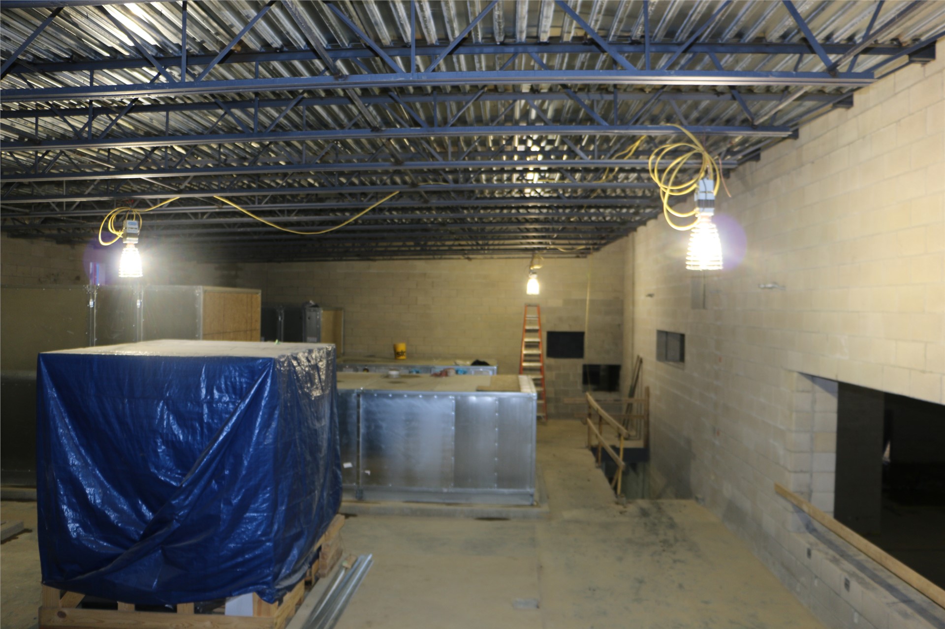 HVAC units on the second floor of the athletic wing (beside gymnasium), Press box window seen to rig