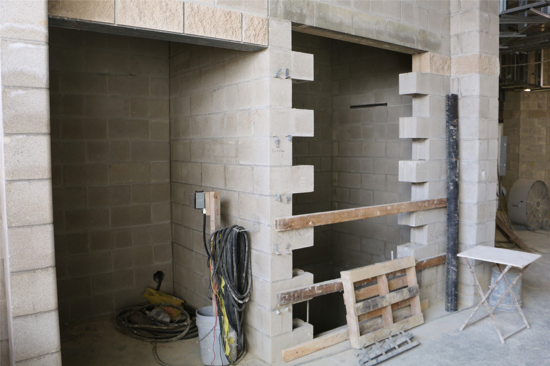 Women’s restroom and elevator shaft at the south end of academics wing