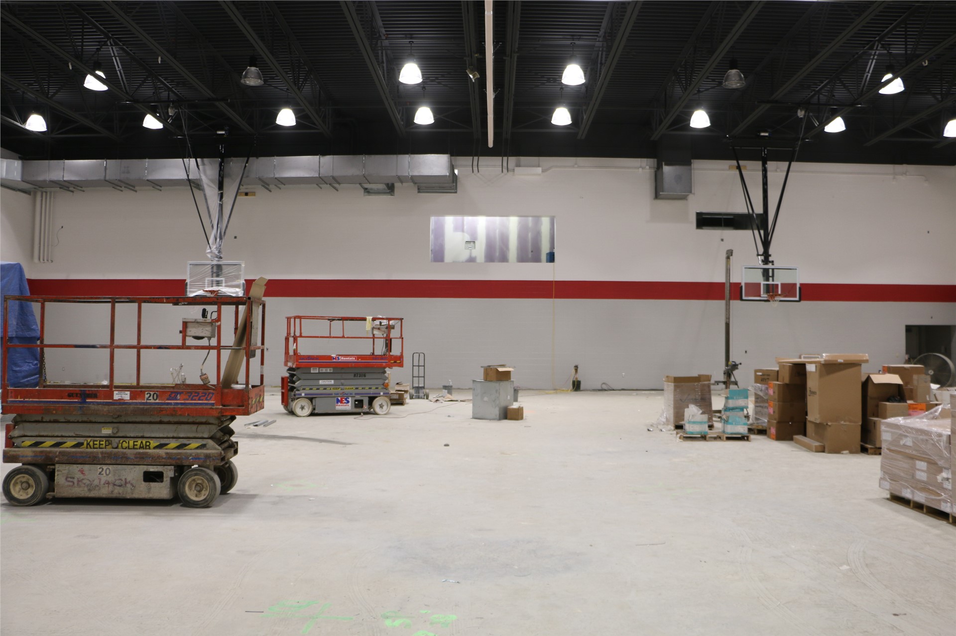 The home side of the gymnasium (press box can be seen above the red accent stripe)