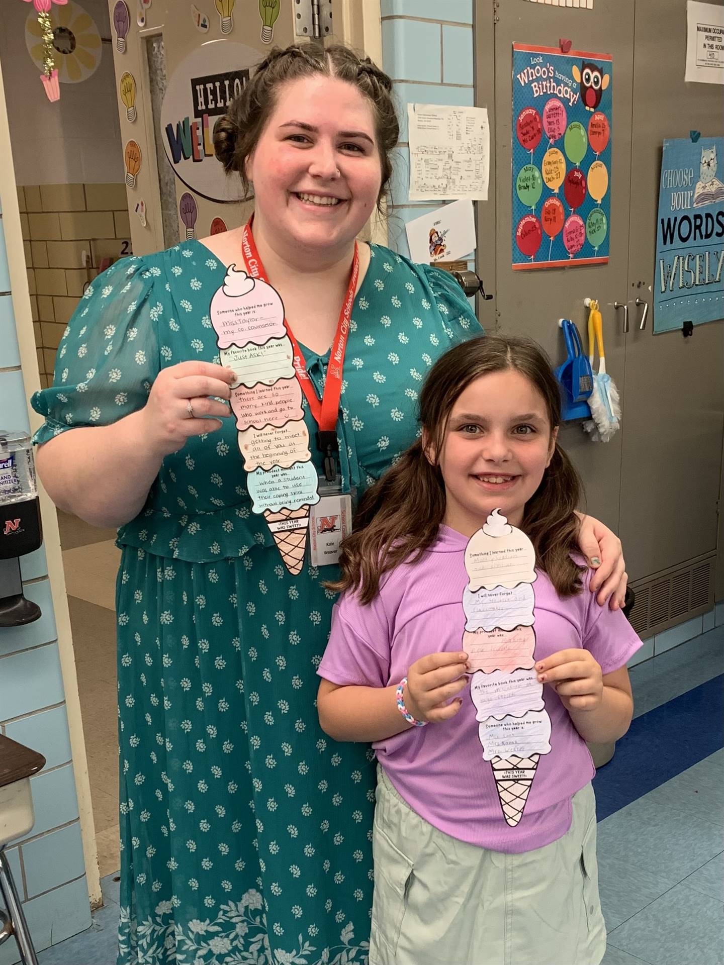 Counselor and Student posing with their ice cream school year reflections.
