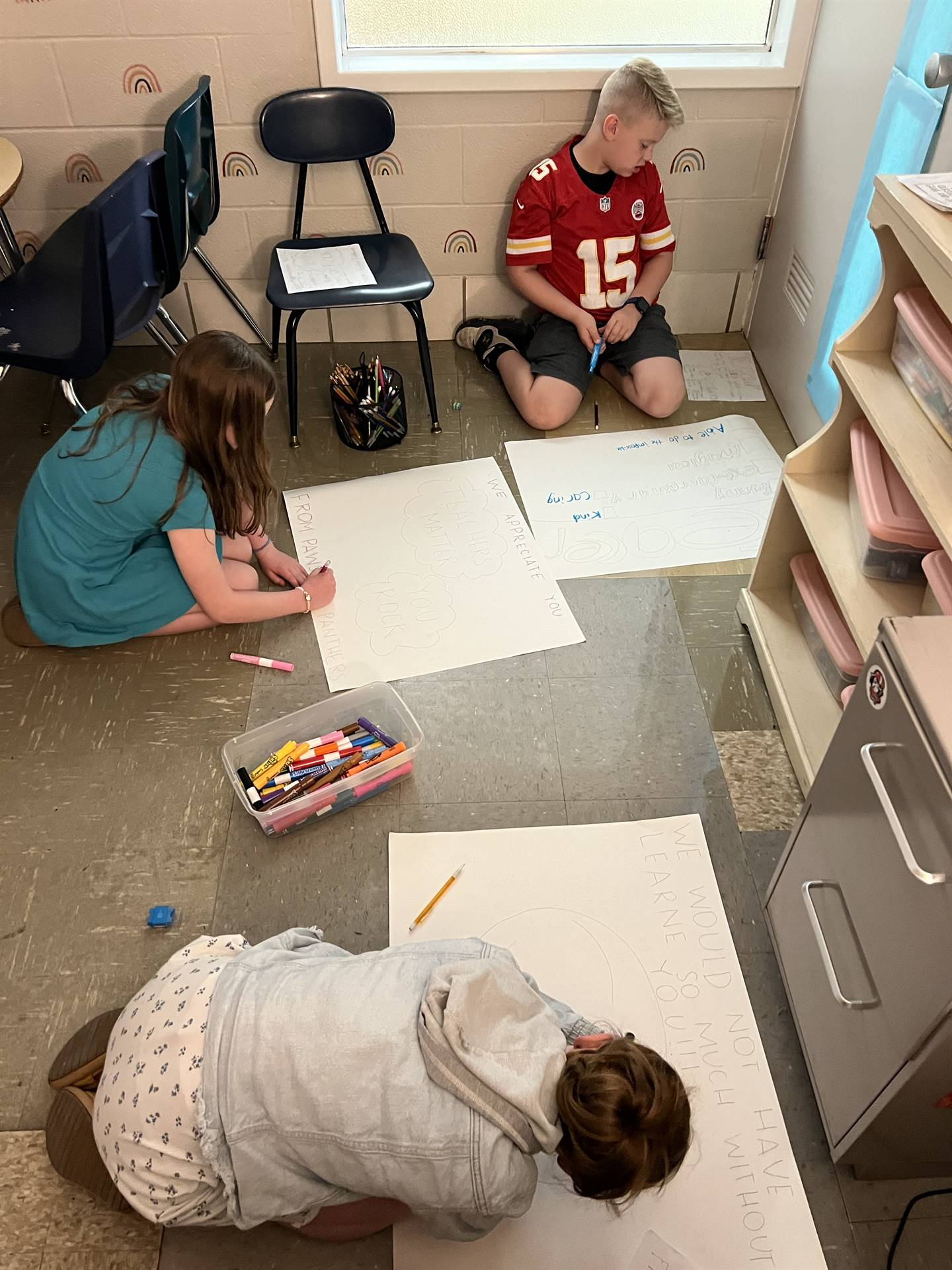4th grade students working on teacher appreciation posters
