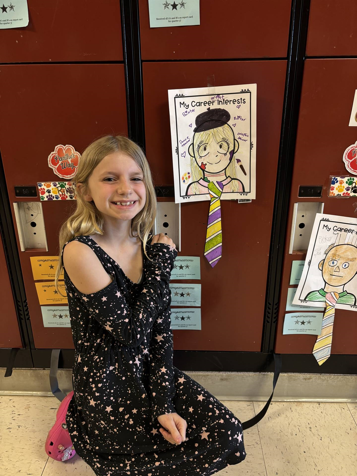 Student sitting by her career tie project.